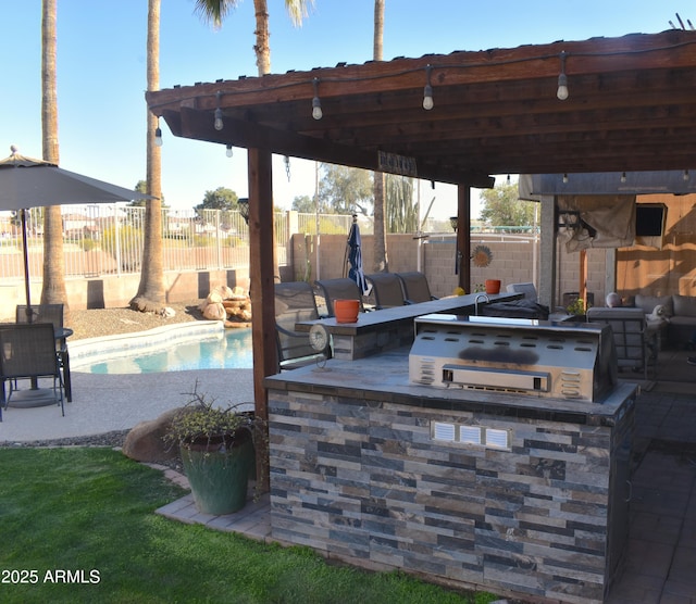 view of patio / terrace with exterior kitchen, a fenced backyard, and a fenced in pool