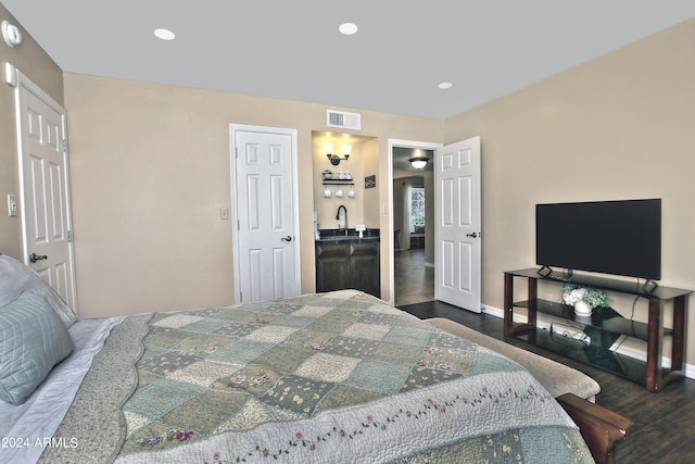 bedroom featuring a closet and dark wood-type flooring