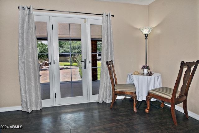 dining area with dark hardwood / wood-style flooring