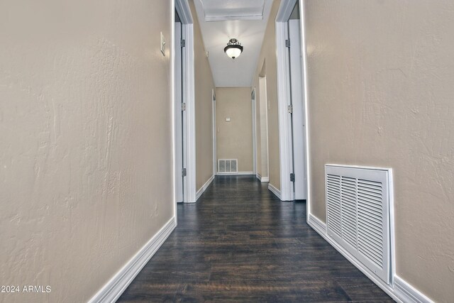 hallway with dark wood-type flooring