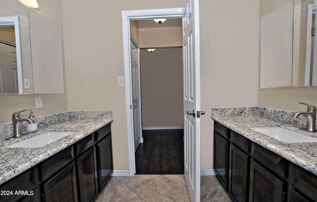 bathroom with tile patterned floors and vanity