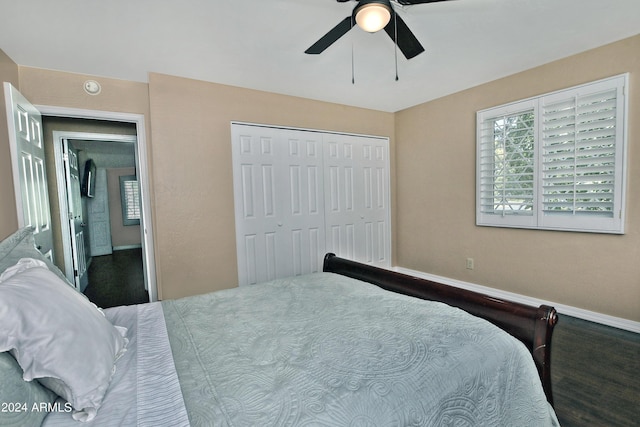 bedroom featuring ceiling fan, a closet, and hardwood / wood-style flooring