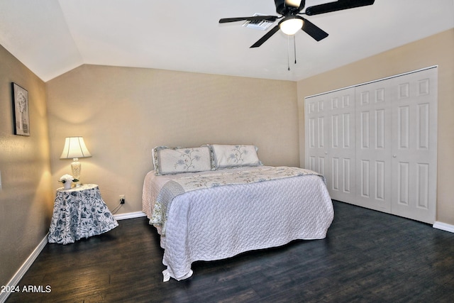 bedroom featuring dark hardwood / wood-style flooring, ceiling fan, a closet, and lofted ceiling