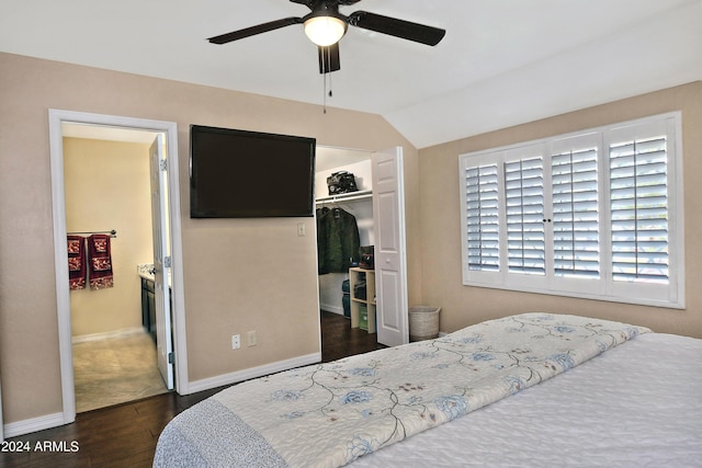 bedroom featuring dark hardwood / wood-style flooring, ceiling fan, a closet, and lofted ceiling