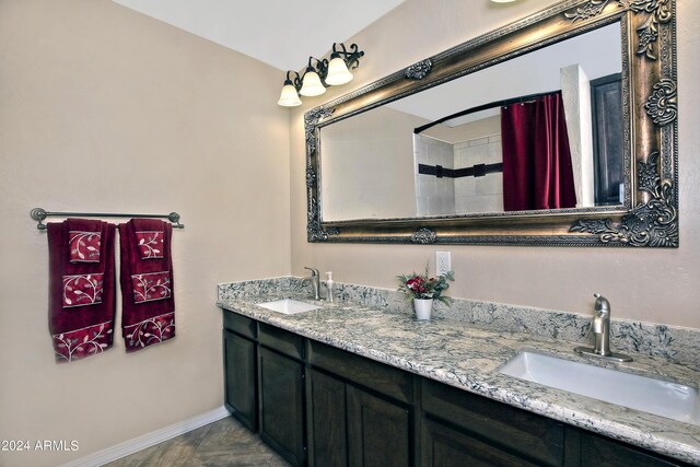 bathroom featuring a shower with shower curtain and vanity