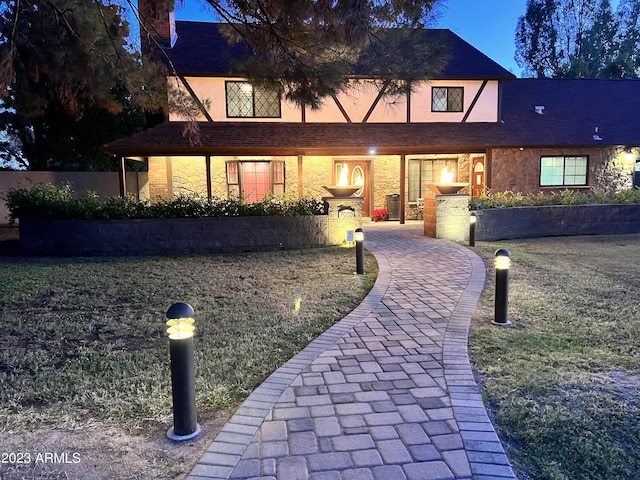 tudor house with a front yard