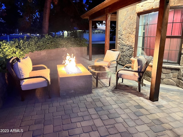 patio at twilight with a fire pit