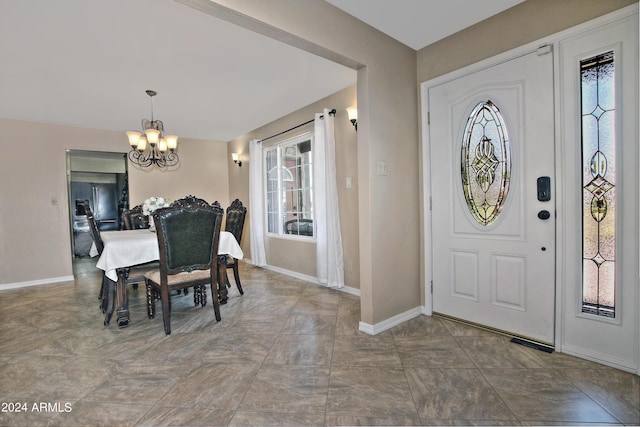 foyer entrance with an inviting chandelier