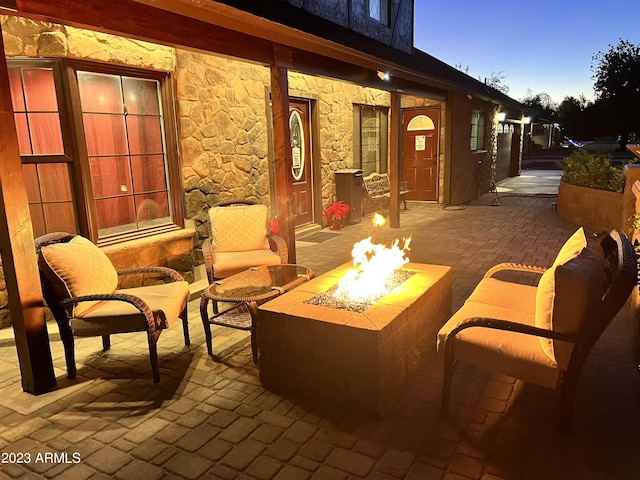 patio terrace at dusk with an outdoor fire pit