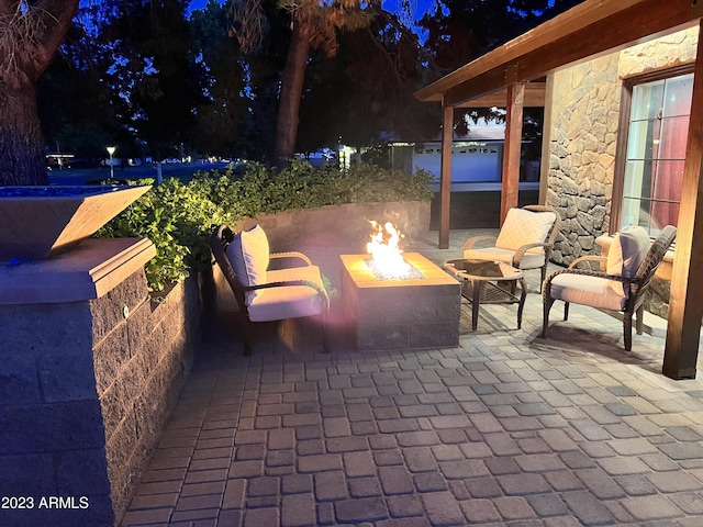 patio at night with an outdoor fire pit