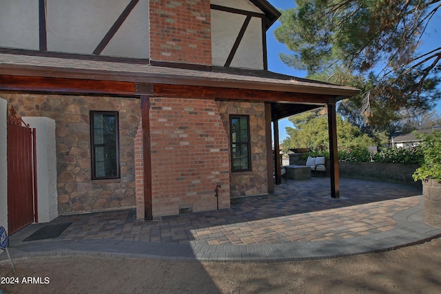 back of property featuring a patio