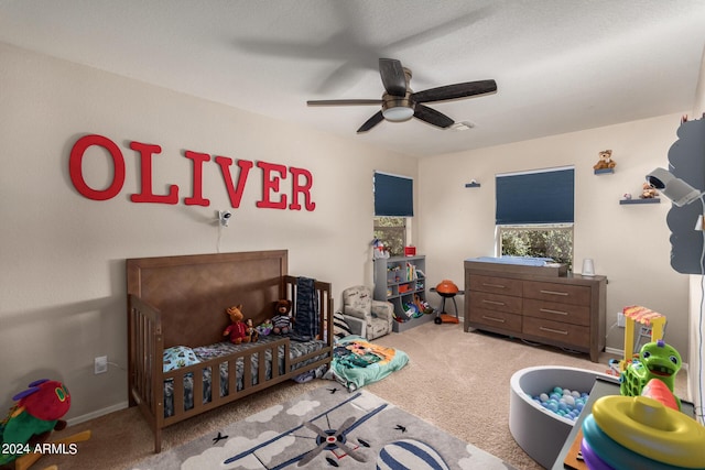 carpeted bedroom featuring ceiling fan