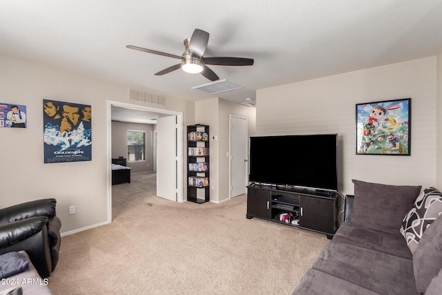 carpeted living room featuring ceiling fan