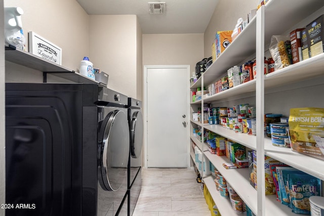 washroom with separate washer and dryer