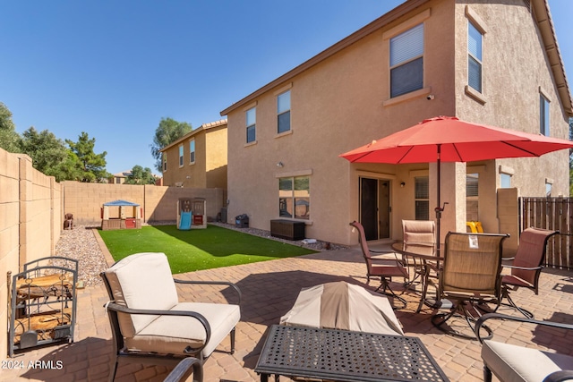 back of house with a patio area