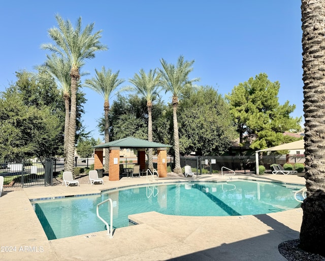 view of swimming pool with a gazebo and a patio