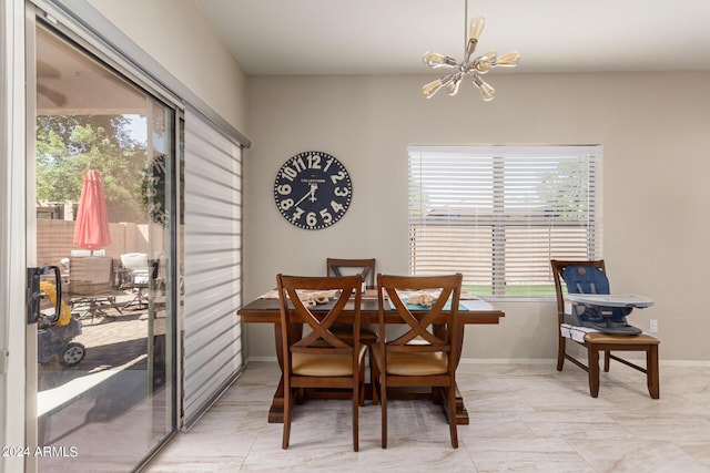 dining space featuring an inviting chandelier