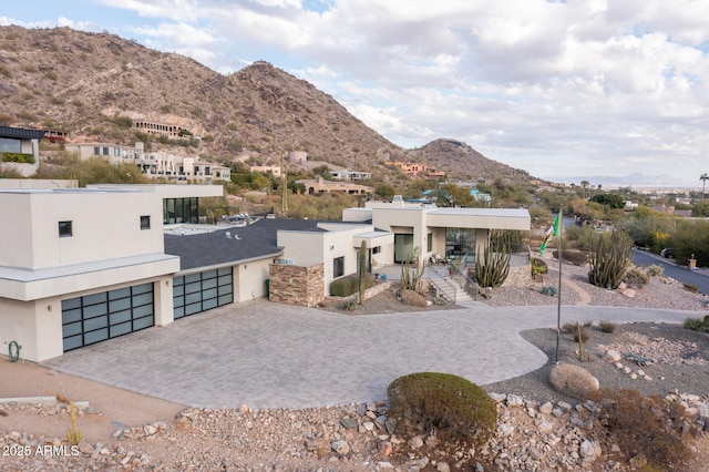 view of front of house with a mountain view and a garage