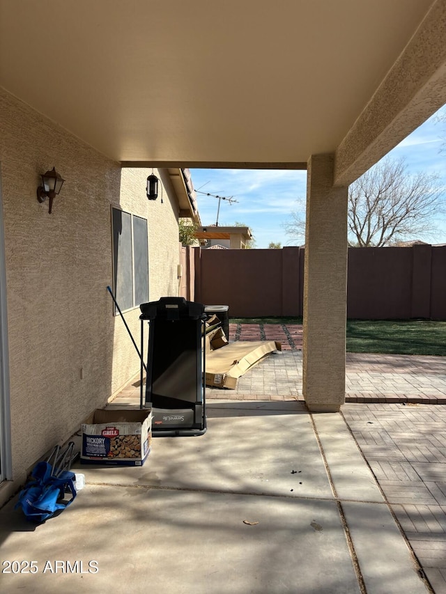 view of patio with fence