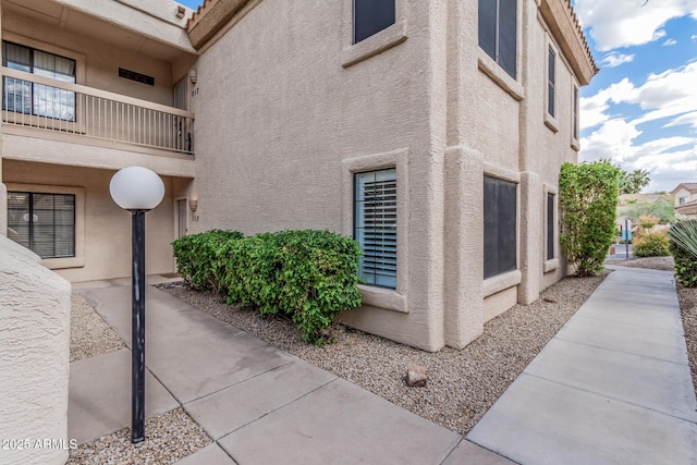 9253 N Firebrick Dr Unit 117, Fountain Hills, AZ 85268 - view of home's exterior with a balcony and stucco siding