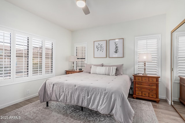 9253 N Firebrick Dr Unit 117, Fountain Hills, AZ 85268 - bedroom with baseboards, a ceiling fan, wood finished floors, and a closet
