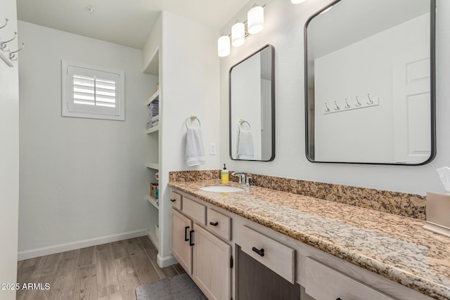 9253 N Firebrick Dr Unit 117, Fountain Hills, AZ 85268 - bathroom with baseboards, wood finished floors, and vanity