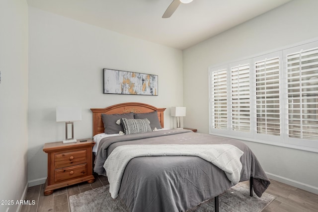 9253 N Firebrick Dr Unit 117, Fountain Hills, AZ 85268 - bedroom with wood finished floors, baseboards, and ceiling fan