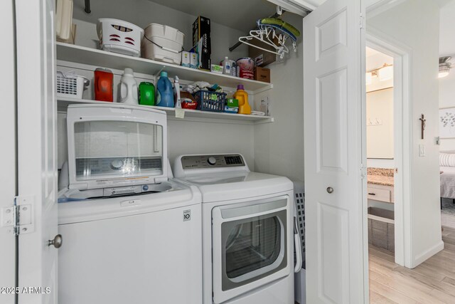 9253 N Firebrick Dr Unit 117, Fountain Hills, AZ 85268 - laundry room featuring independent washer and dryer, light wood-style floors, and laundry area