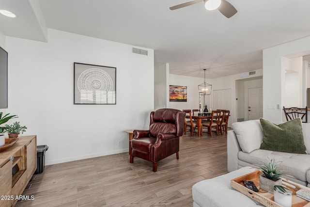 9253 N Firebrick Dr Unit 117, Fountain Hills, AZ 85268 - living area featuring light wood-style floors, visible vents, a ceiling fan, and baseboards