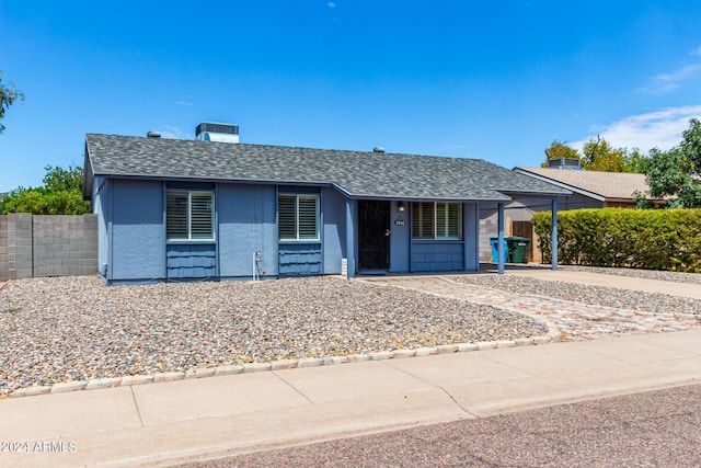 ranch-style house with a carport