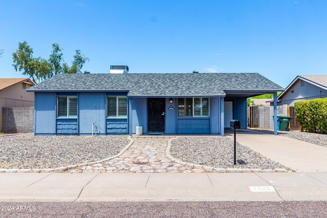 single story home with a carport