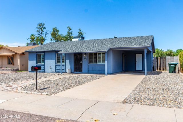 single story home with a carport