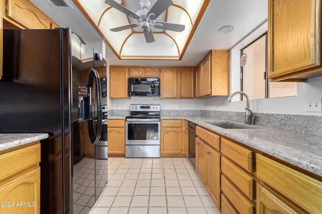 kitchen featuring ceiling fan, sink, a raised ceiling, light tile patterned floors, and black appliances