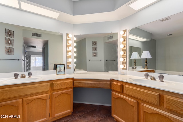 bathroom featuring tile patterned floors and vanity