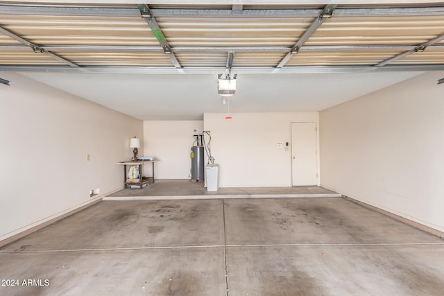 garage with water heater and a garage door opener