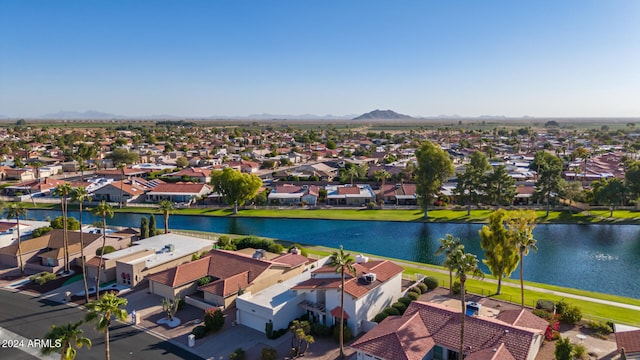 aerial view featuring a water and mountain view