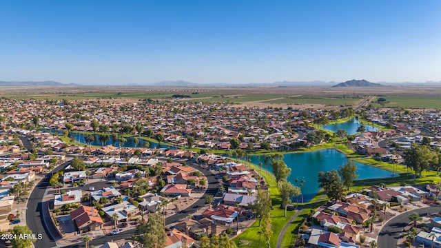 birds eye view of property with a water and mountain view