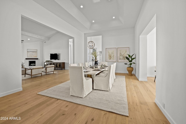 dining room featuring an inviting chandelier and light hardwood / wood-style flooring