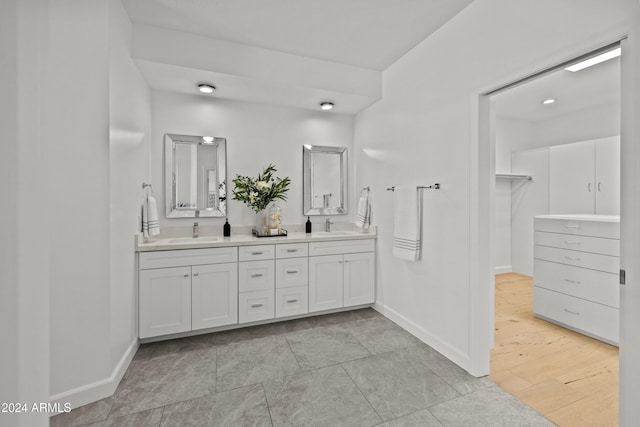 bathroom featuring hardwood / wood-style flooring and vanity