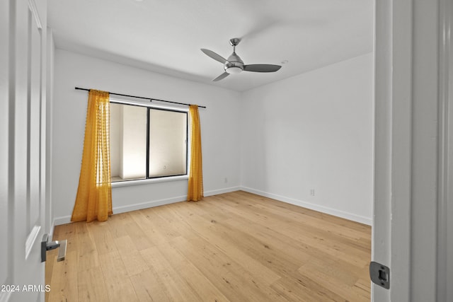 spare room featuring ceiling fan and light hardwood / wood-style floors