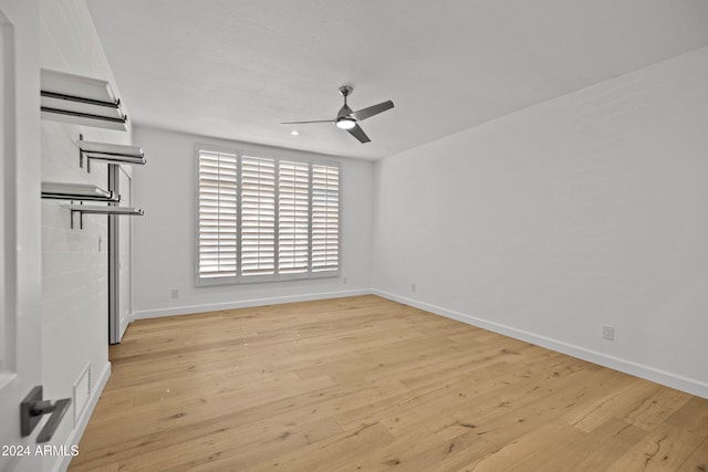 unfurnished room featuring ceiling fan and light wood-type flooring