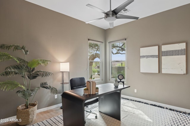 home office with ceiling fan, visible vents, and baseboards