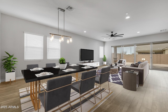 dining space featuring ceiling fan and light hardwood / wood-style floors