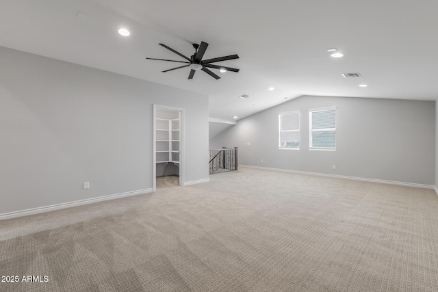 unfurnished living room featuring light carpet, ceiling fan, and lofted ceiling