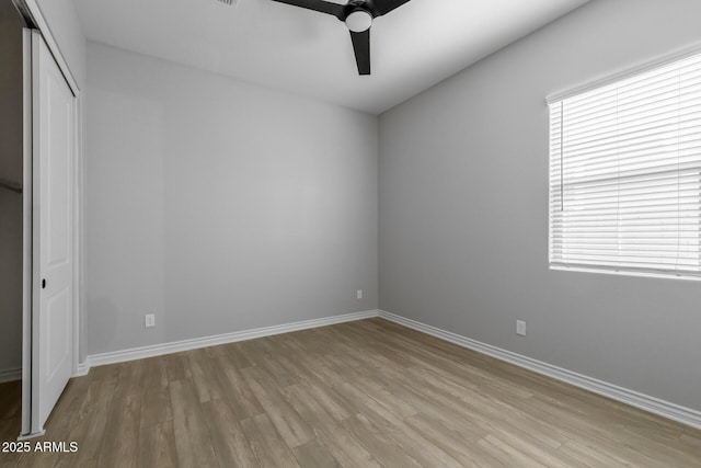 spare room with ceiling fan and light hardwood / wood-style floors