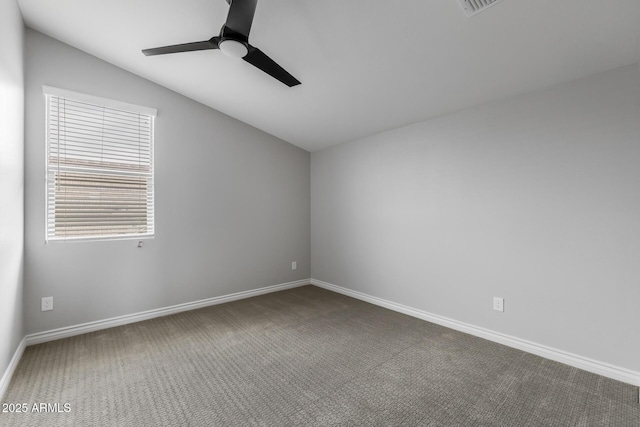 carpeted empty room with ceiling fan and vaulted ceiling