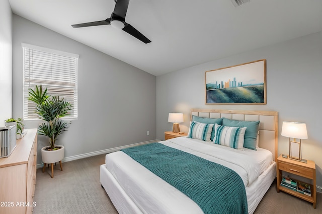 bedroom featuring ceiling fan, carpet flooring, and lofted ceiling