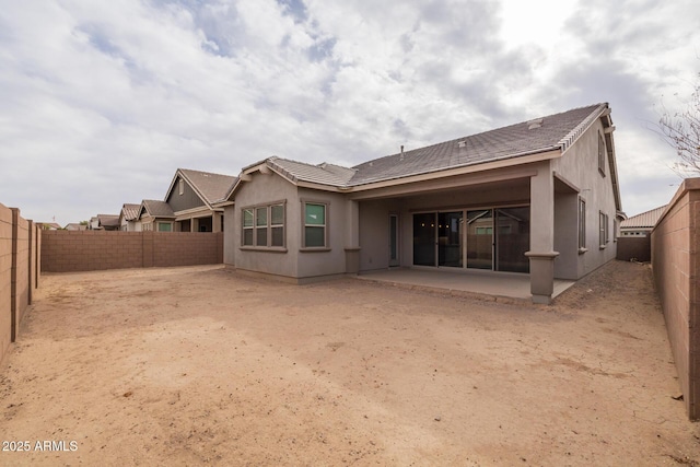 rear view of house with a patio