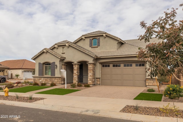 mediterranean / spanish-style house with a garage