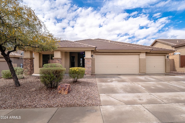 prairie-style house featuring a garage